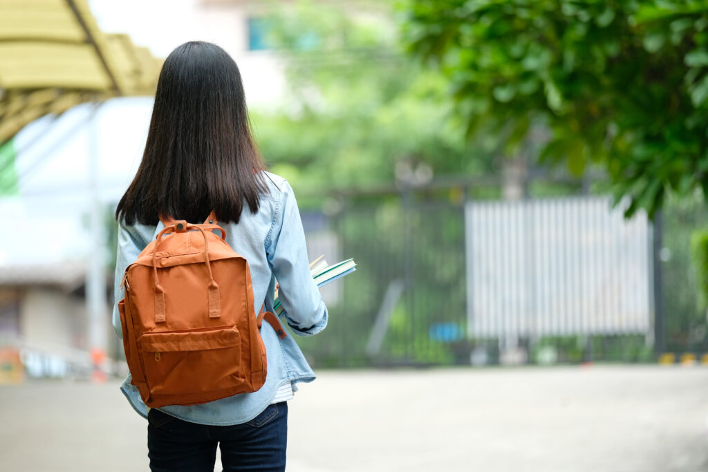 young student with backpack looking for ways to reduce student loan debt