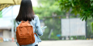 young student with backpack looking for ways to reduce student loan debt