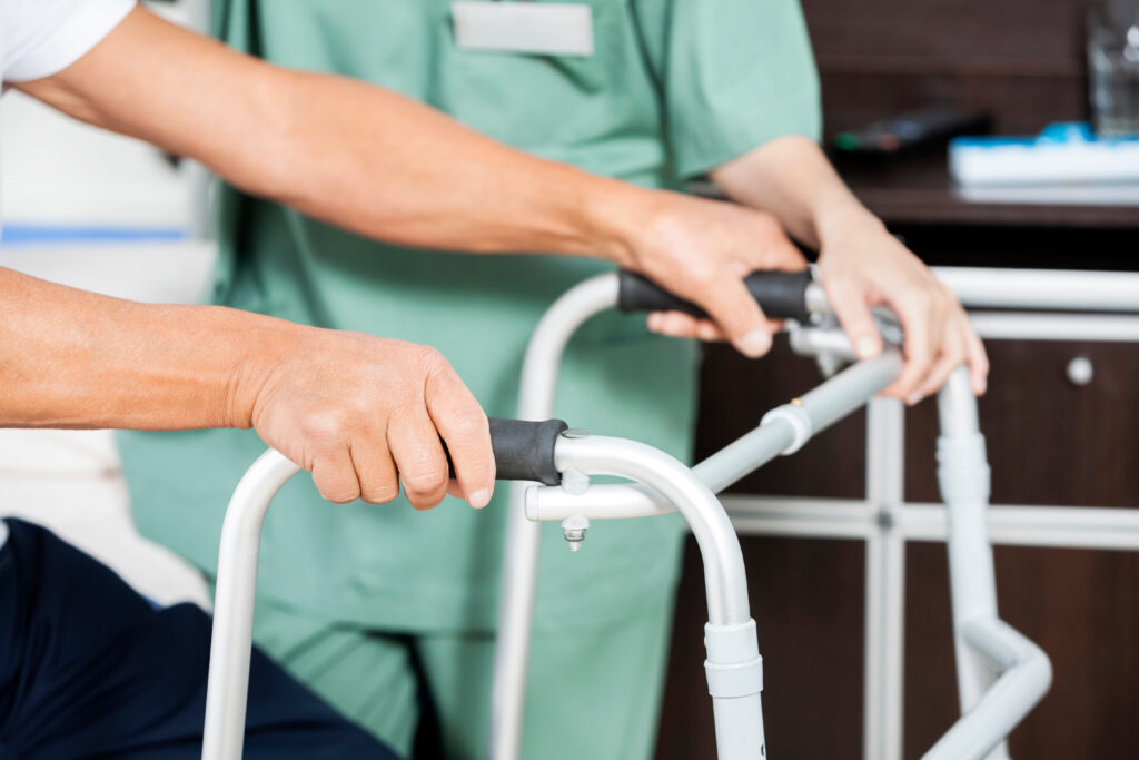 man holding a walker finding out how to deal with short or long term disability