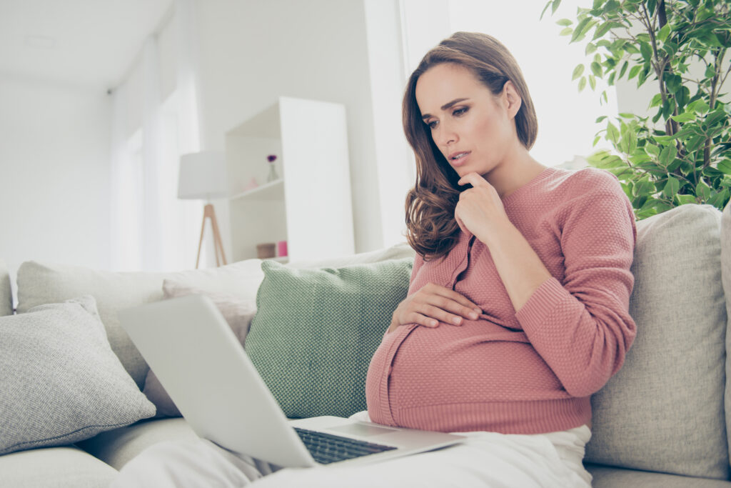 pregnant woman wondering how much does it cost to raise a child?