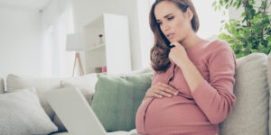 pregnant woman wondering how much does it cost to raise a child?