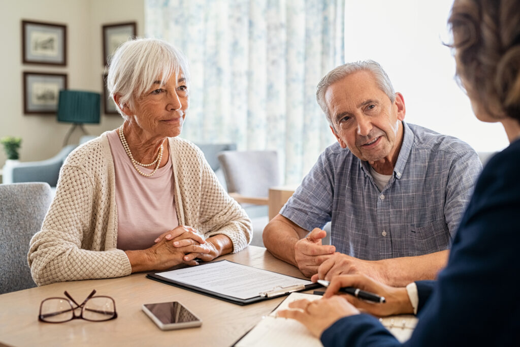 older couple asking advisor is they should borrow from retirement savings