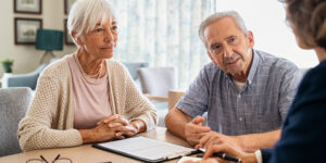 older couple asking advisor is they should borrow from retirement savings